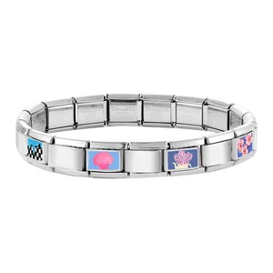 Detail of Italian modular bracelet in stainless steel with colorful enamel floral charms