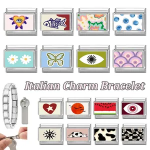 Italian charm bracelet links featuring heart, butterfly, and eye patterns with assembly tool