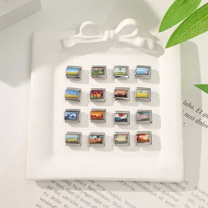 Close-up of 16 Italian charm bracelet links featuring miniature painted landscape scenery