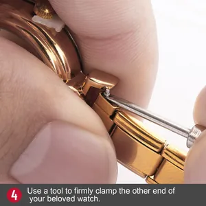 Macro view of rose gold metal watch strap link being adjusted with a precision tool