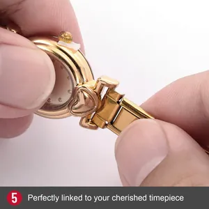 Detailed macro view showing the gold heart link attachment to a watch strap