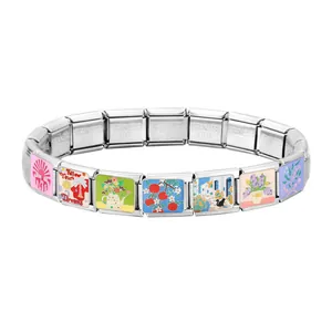 Macro detail of Italian modular charm bracelet links with colorful enamel art and patterns