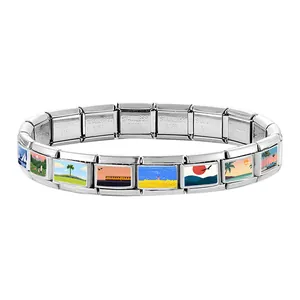 Macro detail of Italian charm bracelet links featuring colorful miniature landscape art