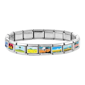 Macro detail of Italian charm bracelet showing landscape paintings and stainless steel stamp