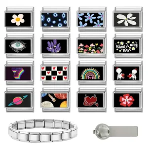 Macro detail of Italian charms set with floral and evil eye patterns in stainless steel