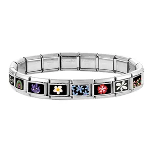 Detail of Italian charm bracelet links with colorful enamel flowers and rainbow patterns