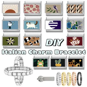 Detail of modular Italian charms in stainless steel with colorful artistic patterns