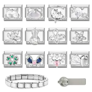 Macro shot of stainless steel Italian charm links with cat, heart and butterfly patterns