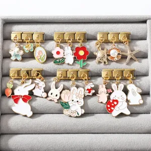 Detail of vintage Italian charm bracelets featuring rabbit, floral, and sea creature motifs