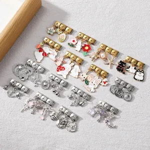 Detail of Italian charm links with colorful enamel pendants and stainless steel bases