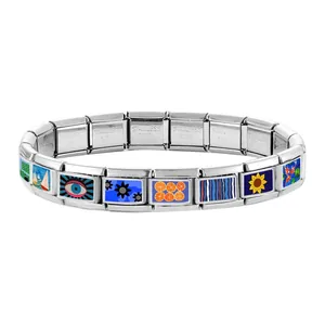 Detailed view of Italian charm bracelet links showing evil eye and floral enamel designs