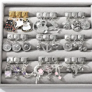 Detailed collection of vintage Italian charm links with cat, star, and heart patterns