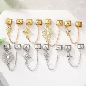 Detailed close-up of golden flower and butterfly Italian charm bracelet modules
