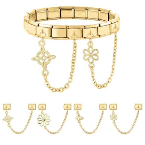 Golden stainless steel Italian charm bracelet with floral and butterfly pendants on white background