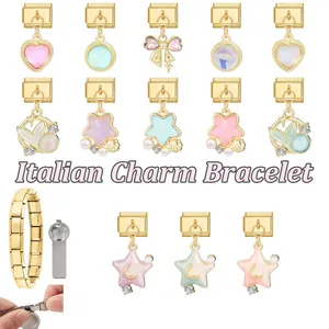 Detailed view of Italian charm bracelet links featuring gold heart and star element charms