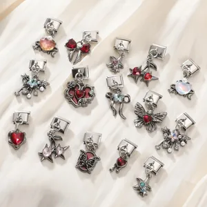 Macro view of 9mm stainless steel Italian charms with heart and butterfly motifs