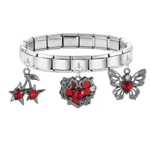 Detail of stainless steel charms with cherry, rose heart and butterfly pendants
