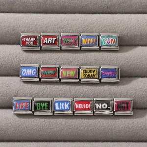 Macro view of Italian charm link collection with colorful enamel quotes on stainless steel