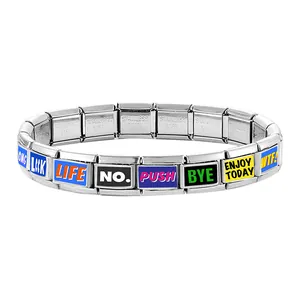 Detail of Italian charm bracelet with colorful enamel letter links and stainless steel texture