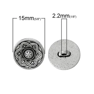 Retro 15mm silver metal button featuring carved floral pattern and textured edge details