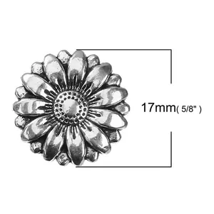 Detailed macro view of 17mm antique silver sunflower metal button with petal texture