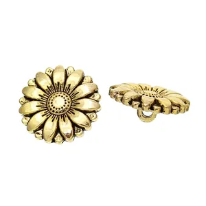 Detail of antique gold sunflower metal button showing petal texture and back loop shank