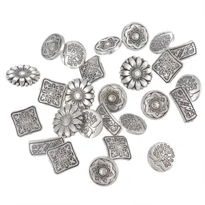 Assorted vintage silver metal buttons with floral and geometric patterns for coats