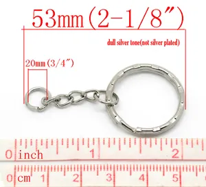 Macro view of 53mm dull silver tone keychain rings with link chain and measurement scale