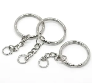 Close-up of polished silver metal key rings with short link chains and split rings