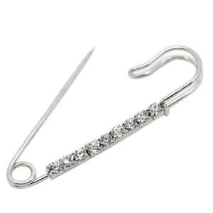 Elegant silver safety pin brooch featuring nine sparkling round rhinestones on white background