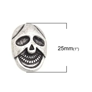 Antique silver skull-shaped 25mm zinc alloy metal button with dual holes for vintage garments