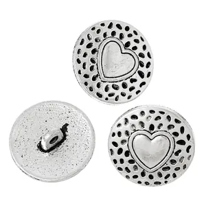 Antique silver metal round shank buttons with heart pattern and dotted texture detail