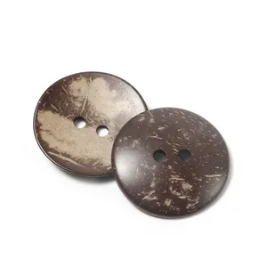 Macro detail of natural brown coconut shell buttons with unique fiber texture and two holes