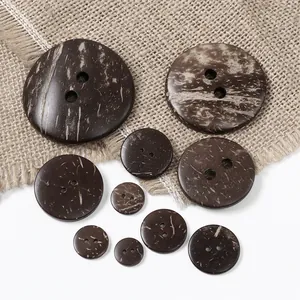 Detailed close-up of brown coconut shell texture buttons in various sizes with two holes