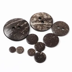 Macro shot of assorted brown coconut shell buttons with natural wood grain and two holes
