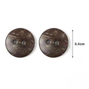 Detail of two 3.8cm round brown coconut shell buttons with two holes on white background