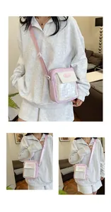 Detail of lavender and white crossbody bag with transparent PVC window and adjustable strap