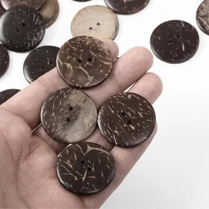 Detail showing natural coconut shell buttons with unique brown fibers and dual-hole design