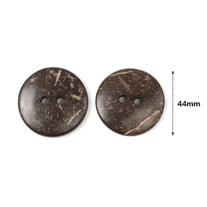 Detail of 44mm brown coconut shell buttons showing natural wood grain texture and two holes