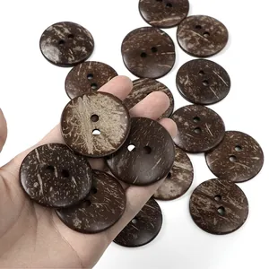 Macro detail of natural brown coconut shell buttons showing unique textured wood patterns