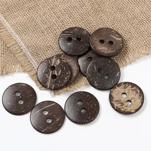 Natural brown coconut shell buttons with two holes on rustic burlap for sewing
