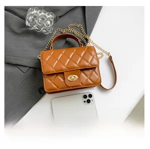 Brown quilted crossbody bag size comparison with a smartphone showing compact interior