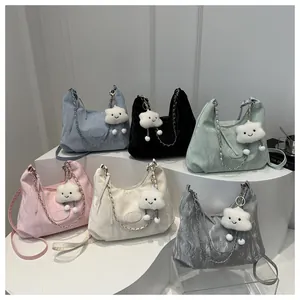 Group view of hobo bags in assorted colors with cloud charms on white display
