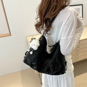 Black large capacity tote bag with pleated texture and white cloud charm on shoulder
