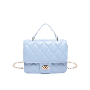 Light blue quilted chain bag with gold twist lock and crossbody strap for women