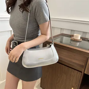 Minimalist silver metallic shoulder bag for women with sleek rectangular design and strap