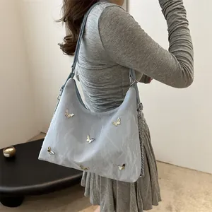 Light blue pleated shoulder bag with silver butterfly charms and adjustable strap for women