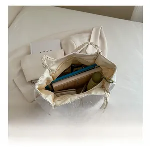 Interior view of white quilted tote bag showing spacious capacity for daily essentials