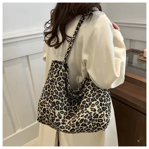 Close-up of retro leopard print corduroy tote bag with wide shoulder strap details