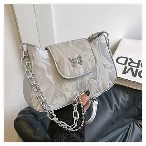Detail of silver marble texture baguette bag with butterfly metal buckle and chain